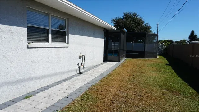 a view of a backyard with a large tree