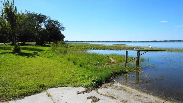 a view of a lake with a garden