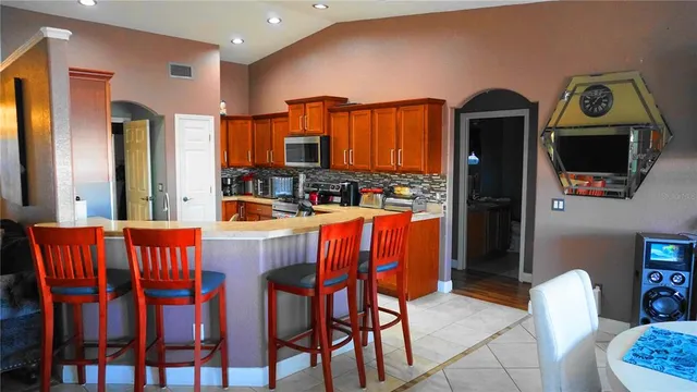 a dining room with furniture and a window