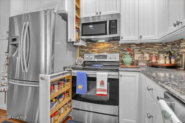 $459,900 | 705 Cypress Lakes Circle Southeast, Bolivia, NC 28422