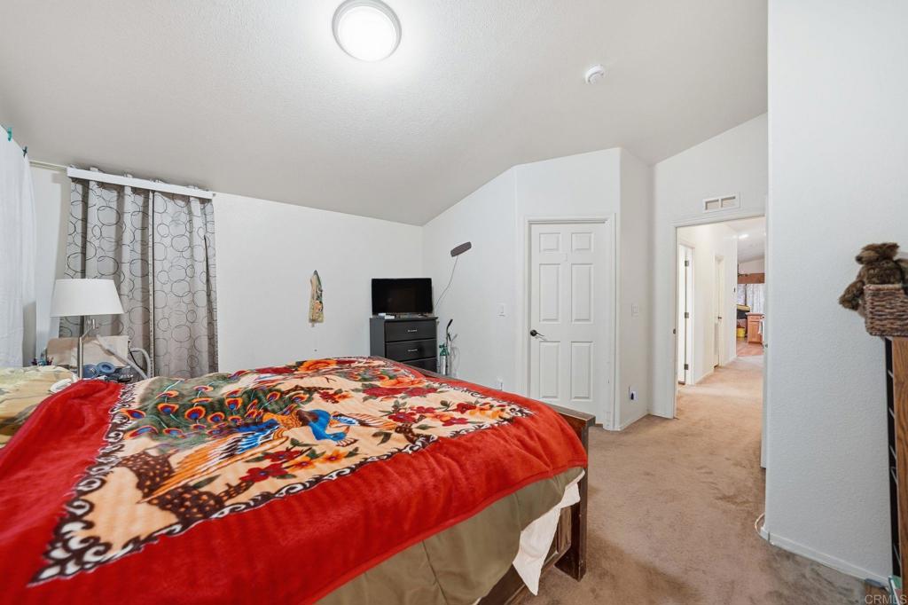 10767 Jamacha Boulevard, Unit SPC 119 Spring Valley, CA 91978 - Photo 12 of 25 a bedroom with a bed and a closet