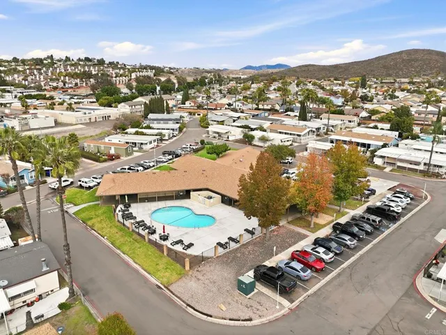 an aerial view of residential houses with outdoor space