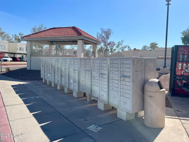 a view of a swimming pool with a patio and a yard