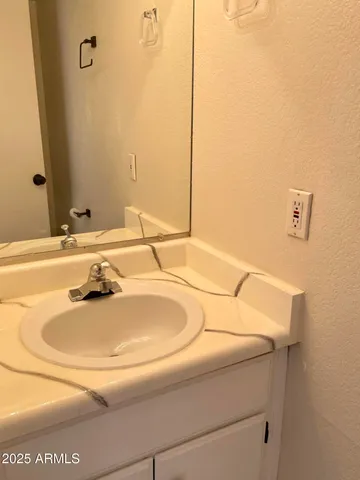 a view of a storage and utility room with a washer dryer