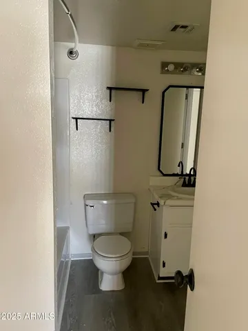 a bathroom with a sink a toilet and a bathtub