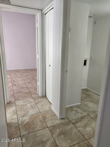 a kitchen with white cabinets