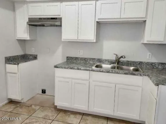 a bathroom with a sink toilet and vanity