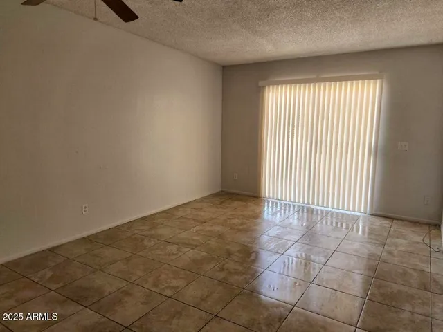 a kitchen with granite countertop a sink and cabinets
