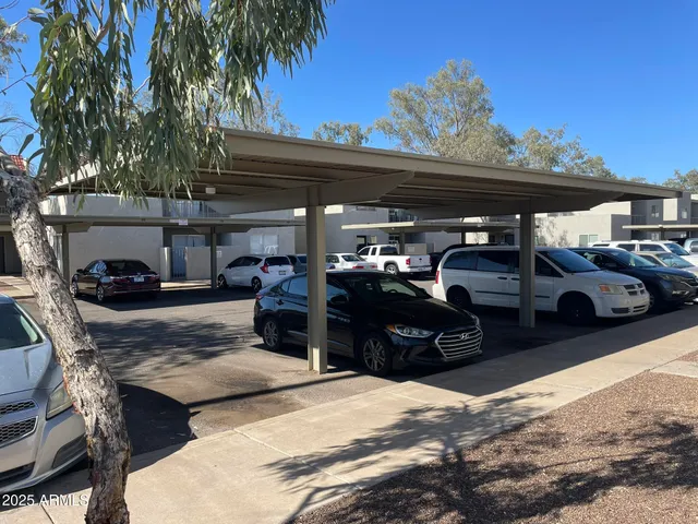 a view of a cars park on the road