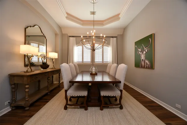 a view of a dining room with furniture and window