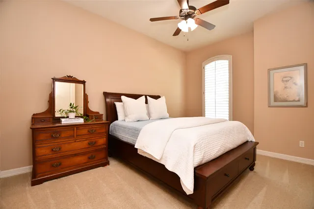 a bedroom with a bed and window