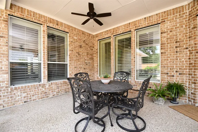a dining room with furniture and windows