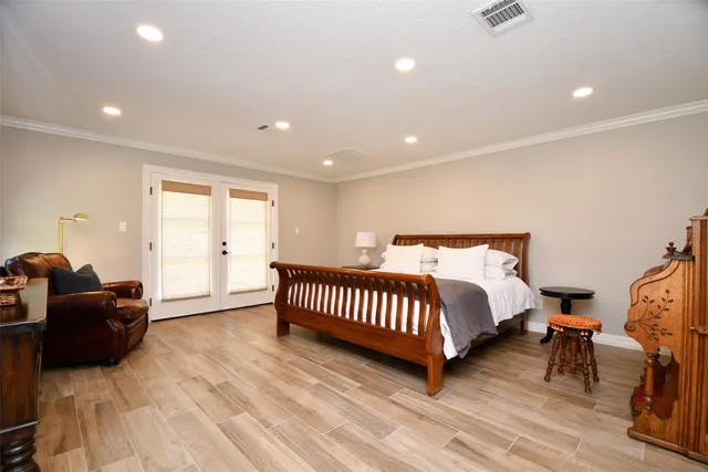 a spacious bedroom with a bed and a couch