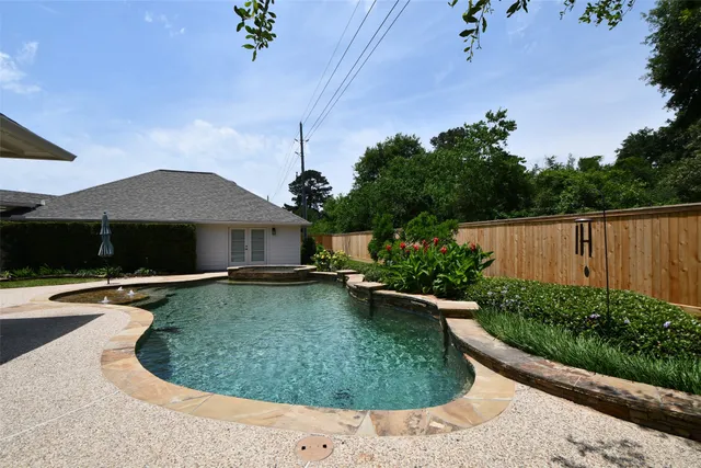 a view of a swimming pool with a patio