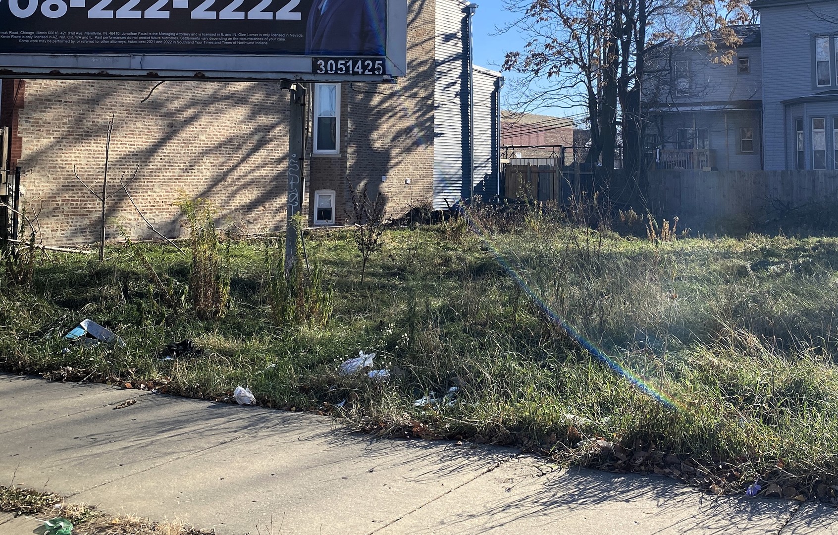 Xxxxx West Cermak Road Chicago, IL 60623 - Photo 3 of 4 a view of a backyard with plants and trees