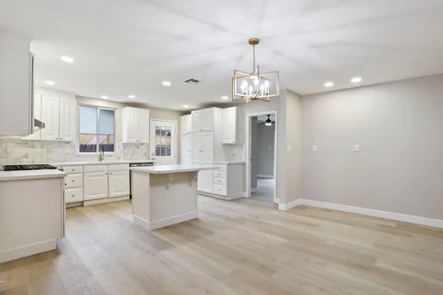 a large kitchen with cabinets