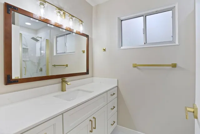 a bathroom with a sink and a mirror