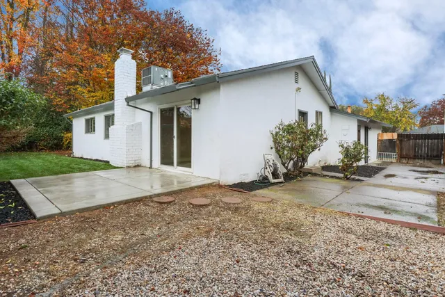 a view of a house with a yard and garage