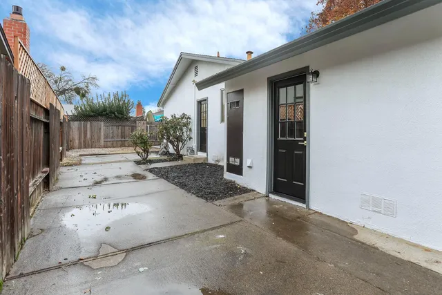 a view of a backyard of the house
