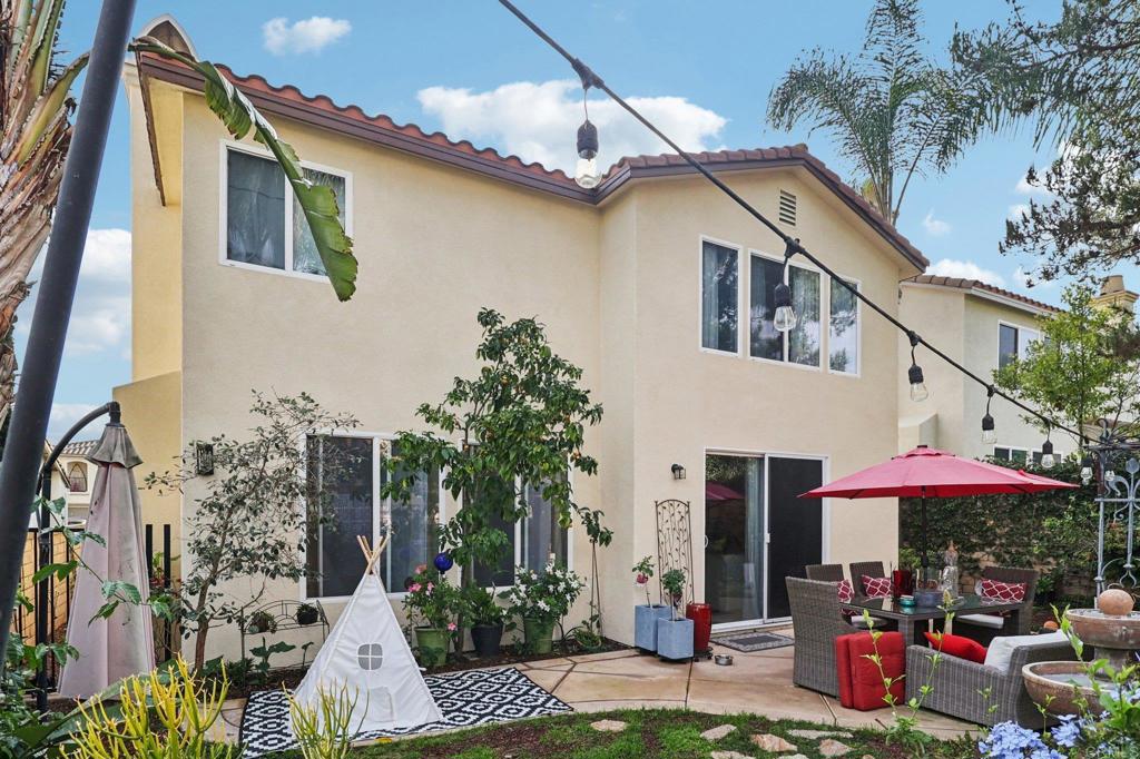 5544 Mill Creek Road San Diego, CA 92130 - Photo 20 of 54 a front view of a house with an outdoor space