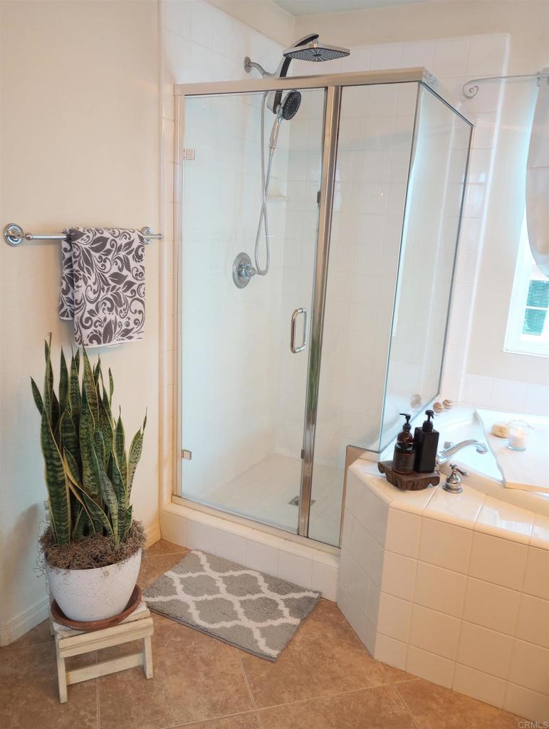 5544 Mill Creek Road San Diego, CA 92130 - Photo 28 of 54 a bathroom with a sink a toilet and shower