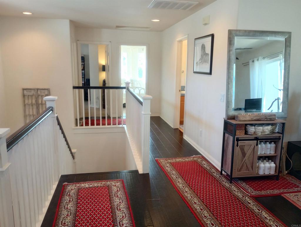 5544 Mill Creek Road San Diego, CA 92130 - Photo 31 of 54 a living room with furniture and a rug