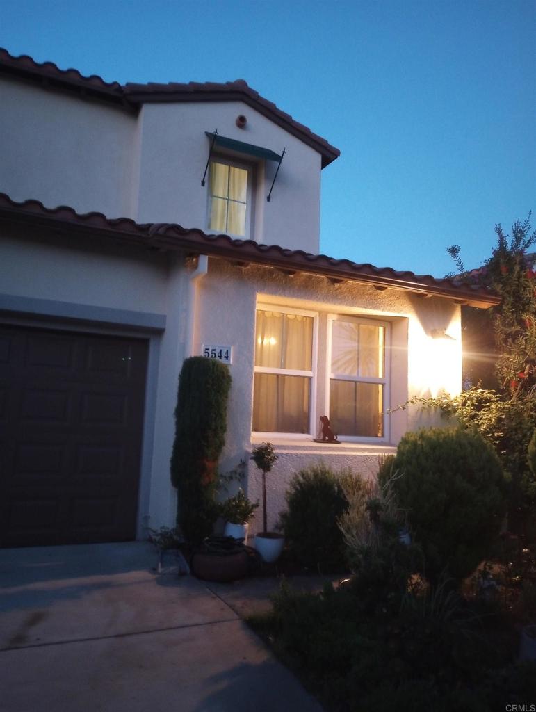 5544 Mill Creek Road San Diego, CA 92130 - Photo 41 of 54 a view of a house with backyard sitting area and garden