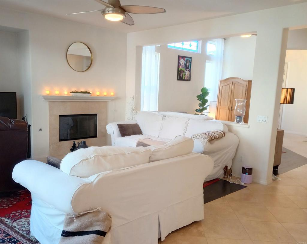 5544 Mill Creek Road San Diego, CA 92130 - Photo 5 of 54 a living room with furniture and a fireplace