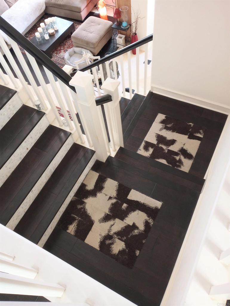5544 Mill Creek Road San Diego, CA 92130 - Photo 10 of 54 a black leather couch in living room with furniture