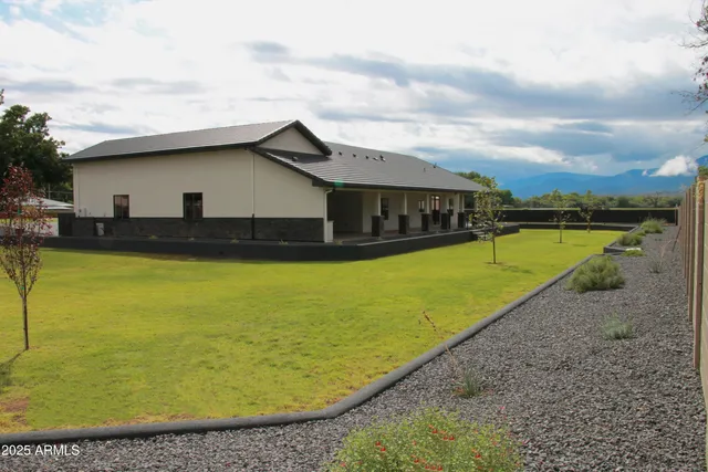 a view of a road with a building in the background