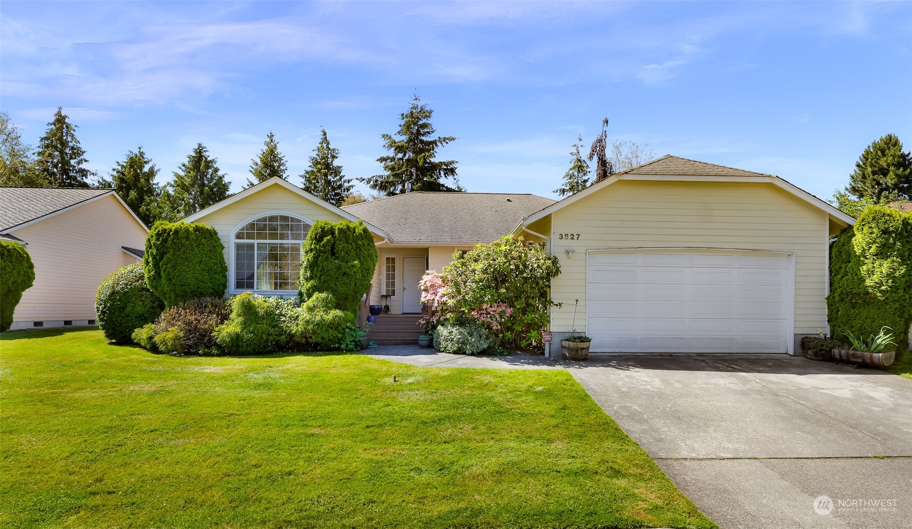 3827 Copper Pond Anacortes, WA 98221 - Photo 1 of 26 a front view of a house with a yard