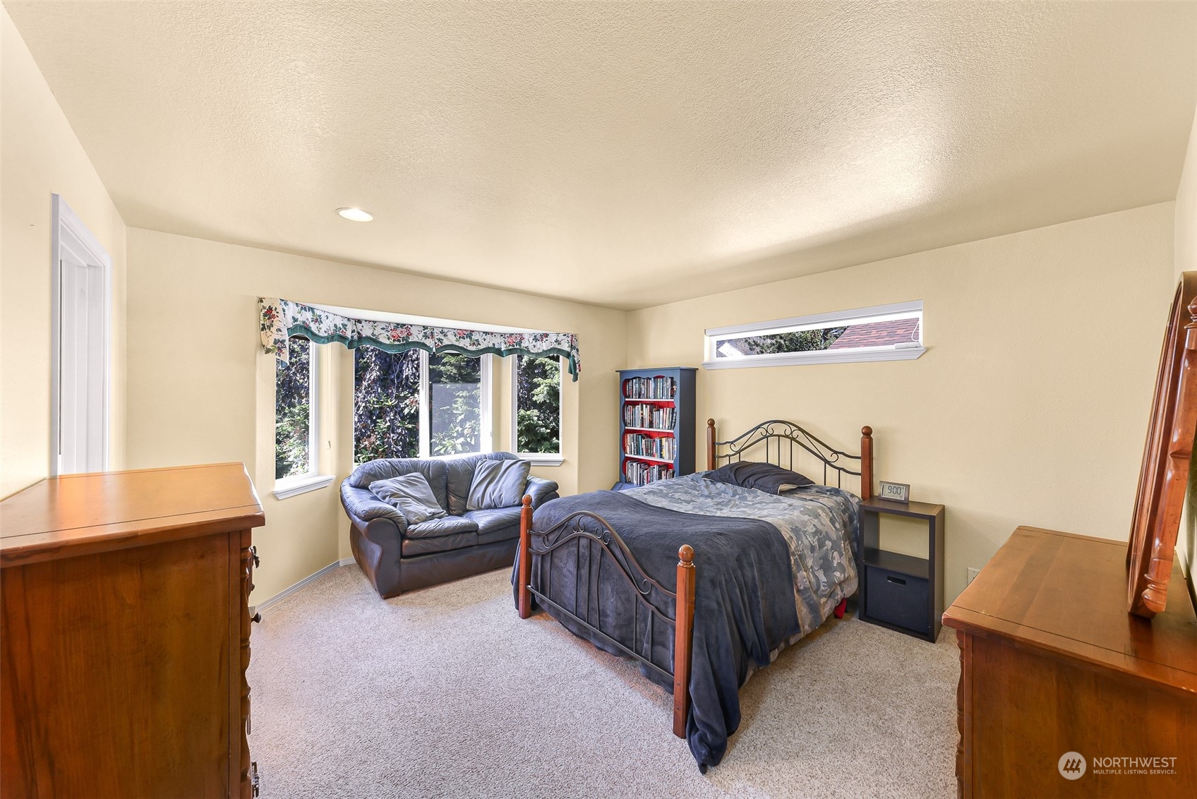 3827 Copper Pond Anacortes, WA 98221 - Photo 12 of 26 a bedroom with a bed and a couch
