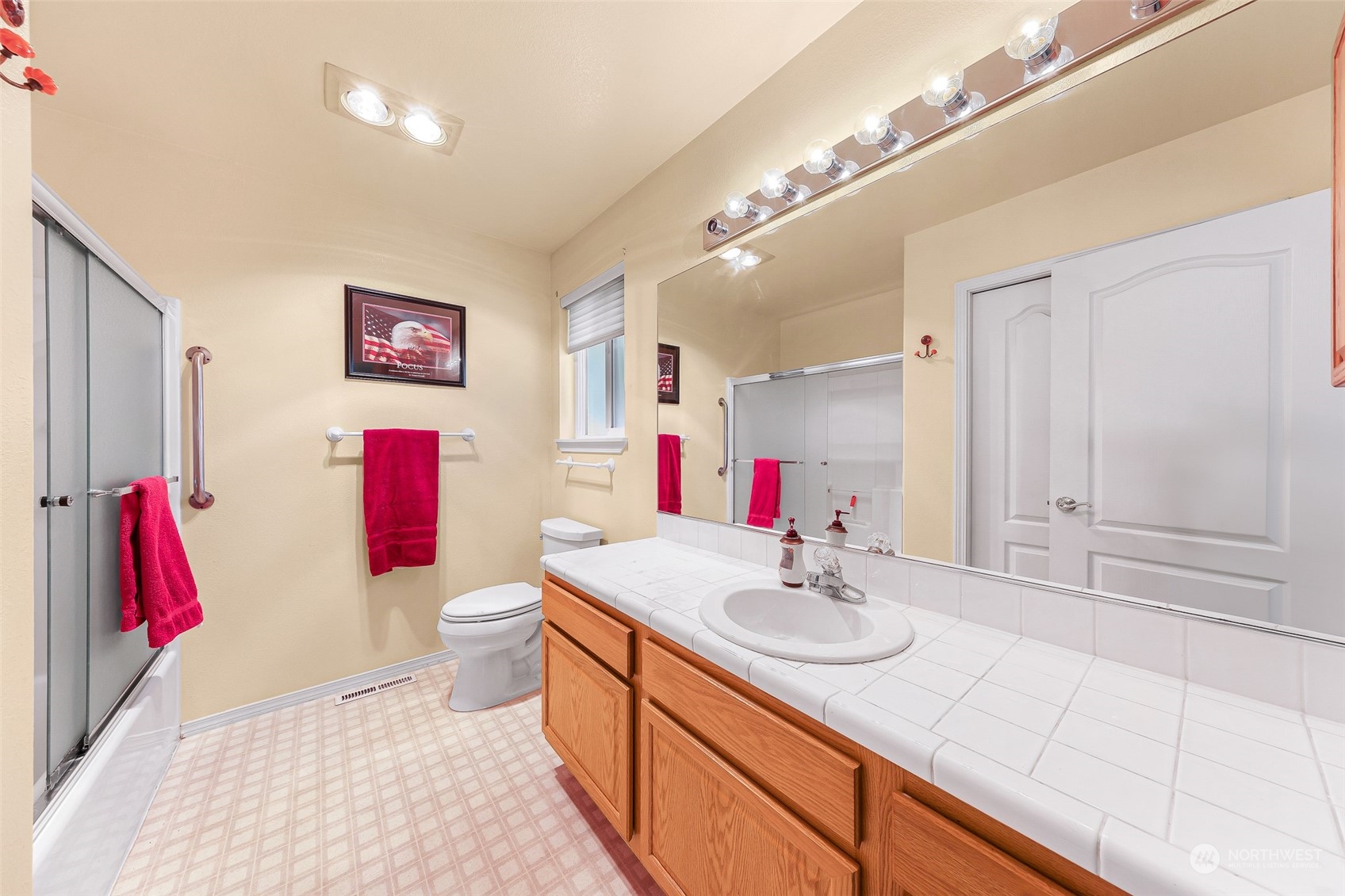 3827 Copper Pond Anacortes, WA 98221 - Photo 15 of 26 a bathroom with a sink vanity mirror and vanity