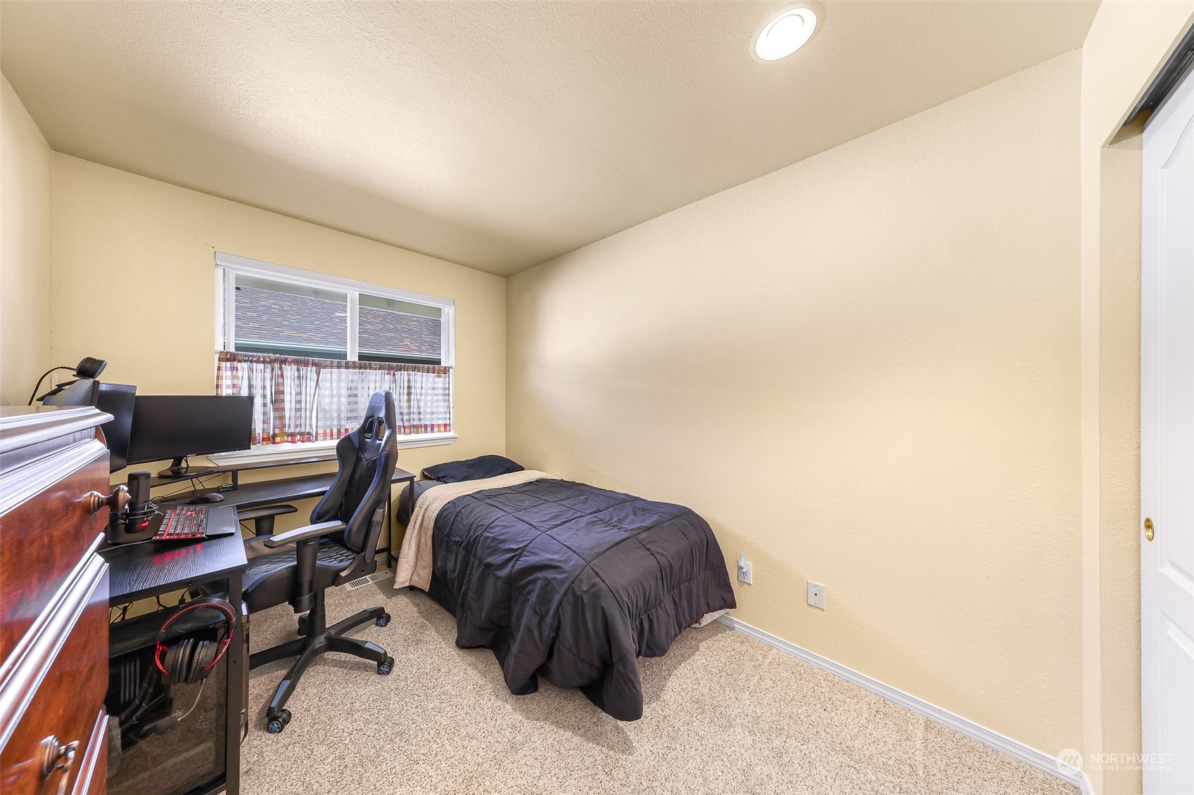 3827 Copper Pond Anacortes, WA 98221 - Photo 16 of 26 a bedroom with a bed and a desk
