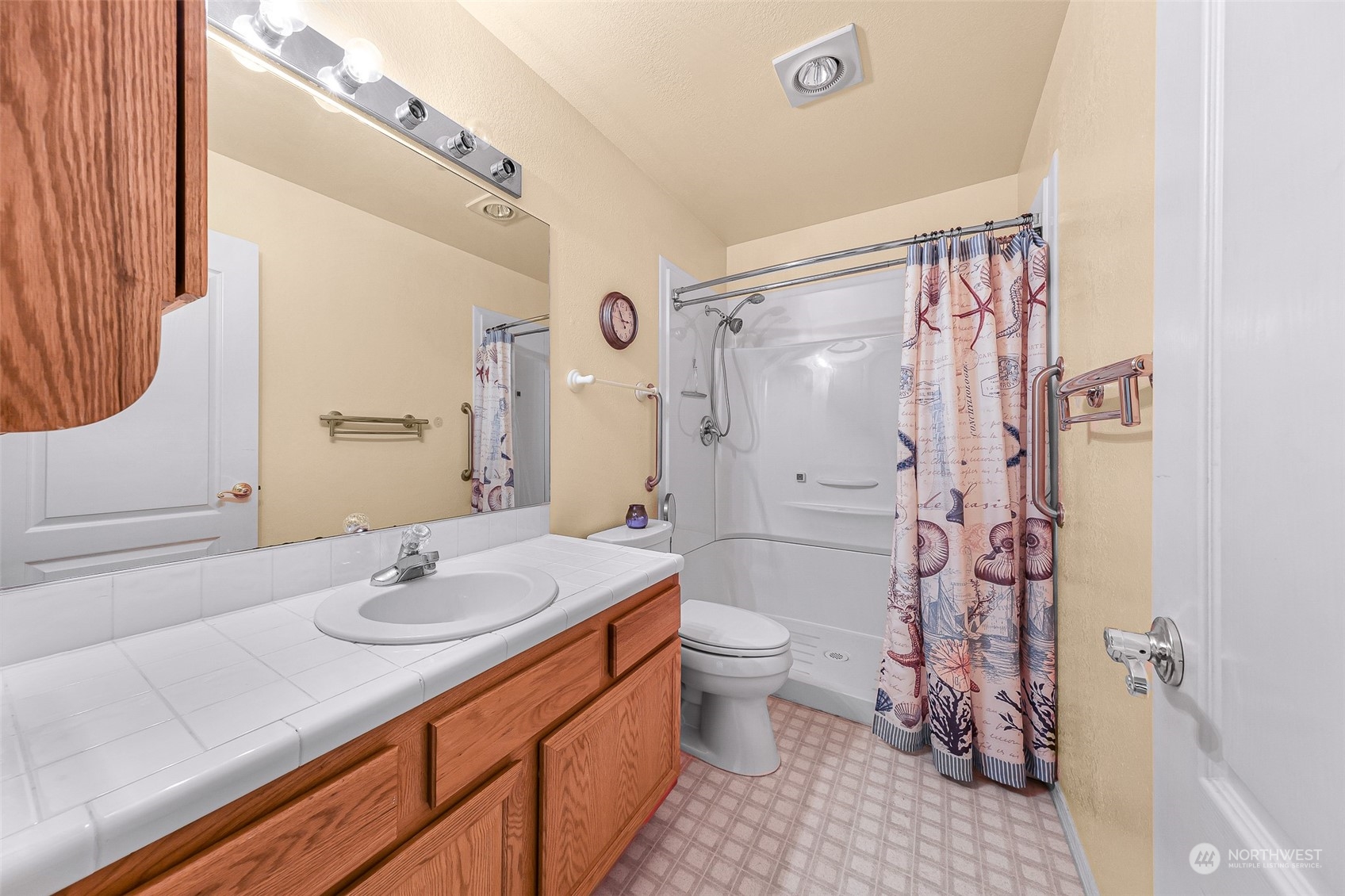 3827 Copper Pond Anacortes, WA 98221 - Photo 17 of 26 a bathroom with a sink toilet and shower