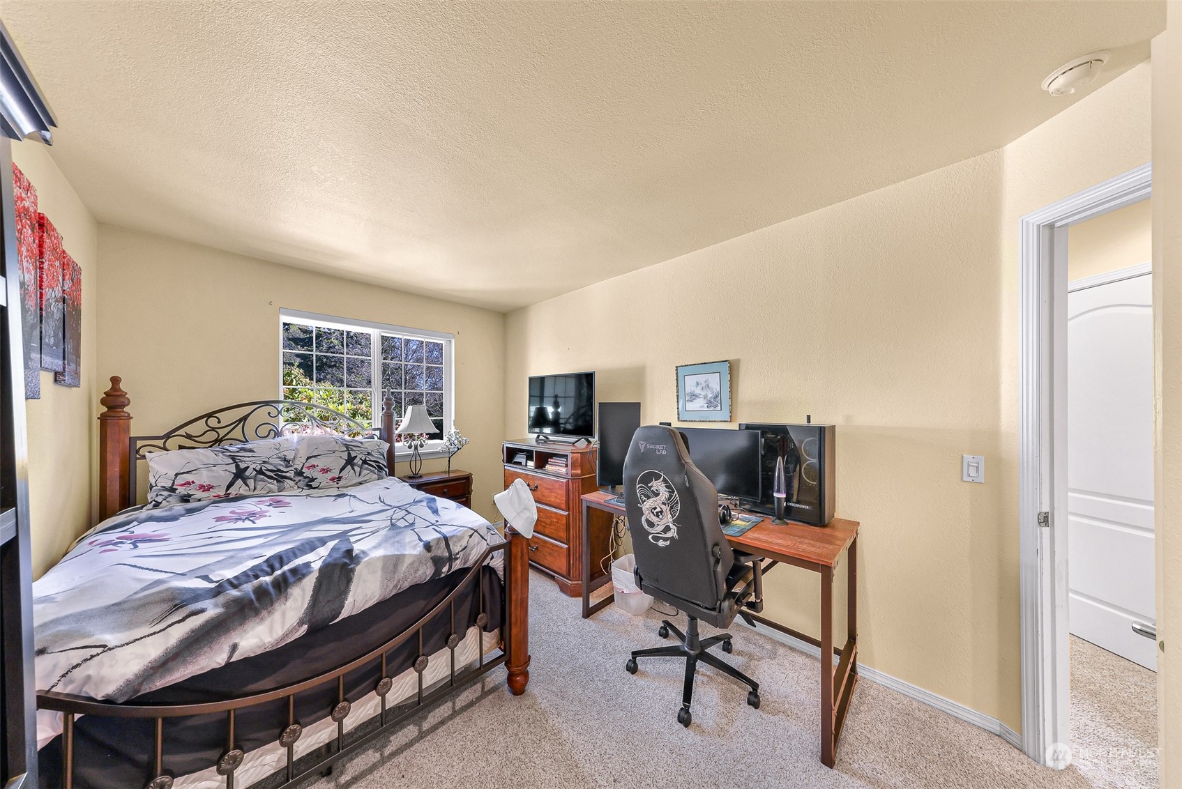 3827 Copper Pond Anacortes, WA 98221 - Photo 19 of 26 a bedroom with a bed and a desk
