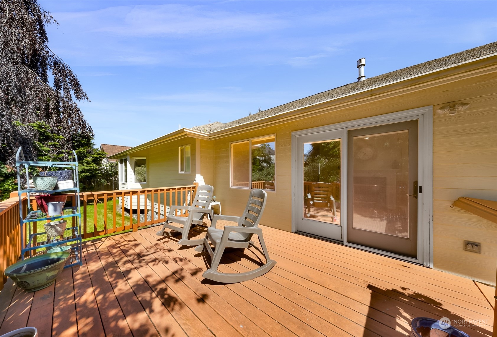 3827 Copper Pond Anacortes, WA 98221 - Photo 20 of 26 a view of a balcony with two chairs and a table