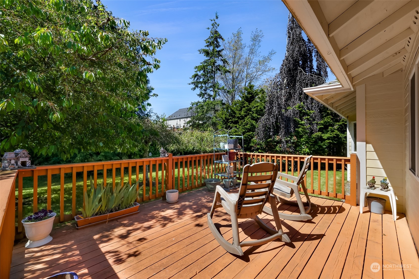 3827 Copper Pond Anacortes, WA 98221 - Photo 21 of 26 a view of balcony with wooden floor and outdoor seating