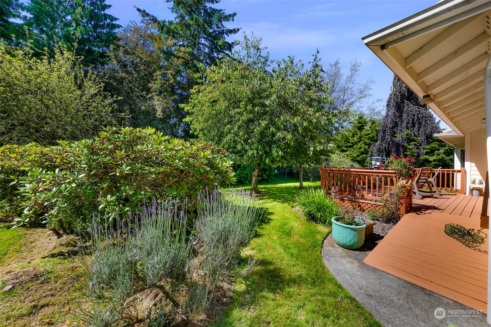 3827 Copper Pond Anacortes, WA 98221 - Photo 22 of 26 a view of a chair and tables front of the house