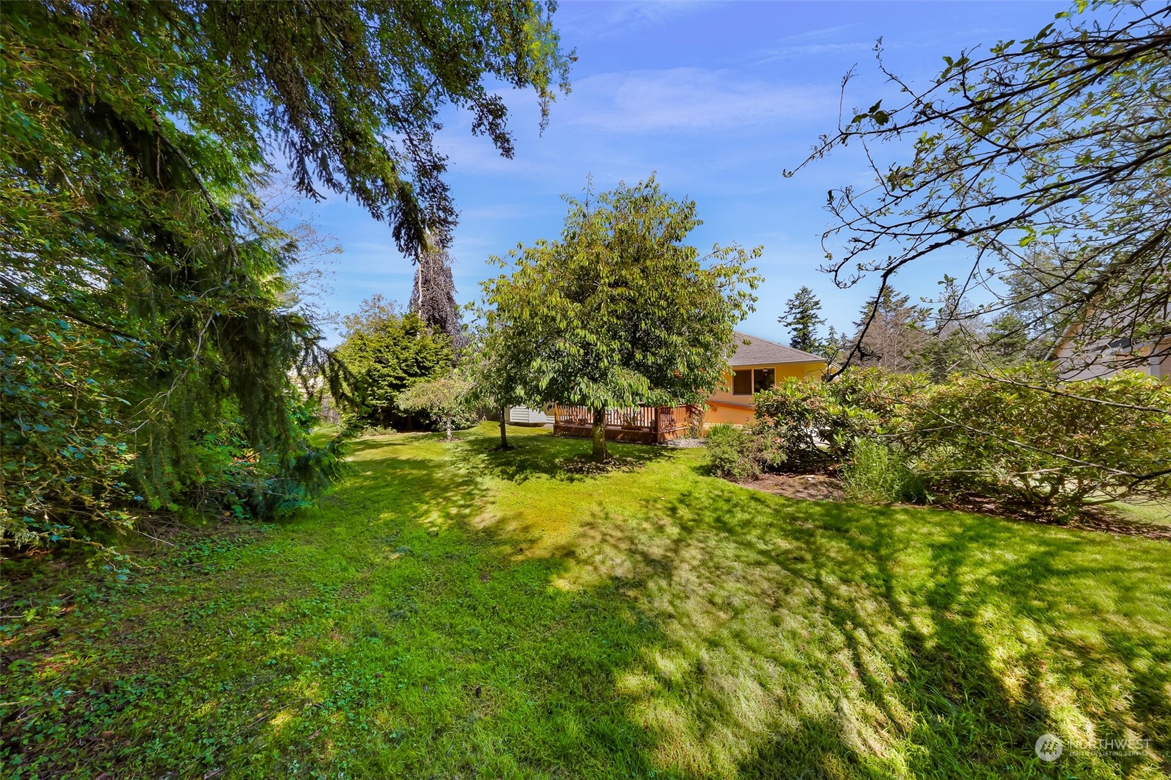 3827 Copper Pond Anacortes, WA 98221 - Photo 24 of 26 a backyard of a house with lots of green space
