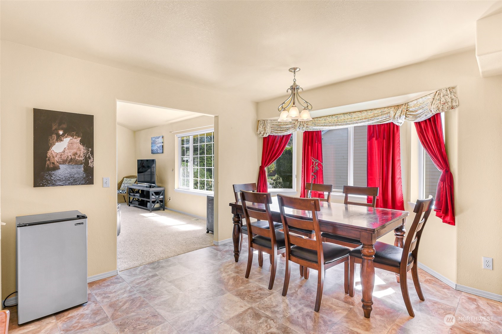 3827 Copper Pond Anacortes, WA 98221 - Photo 4 of 26 a view of a dining room with furniture and chandelier