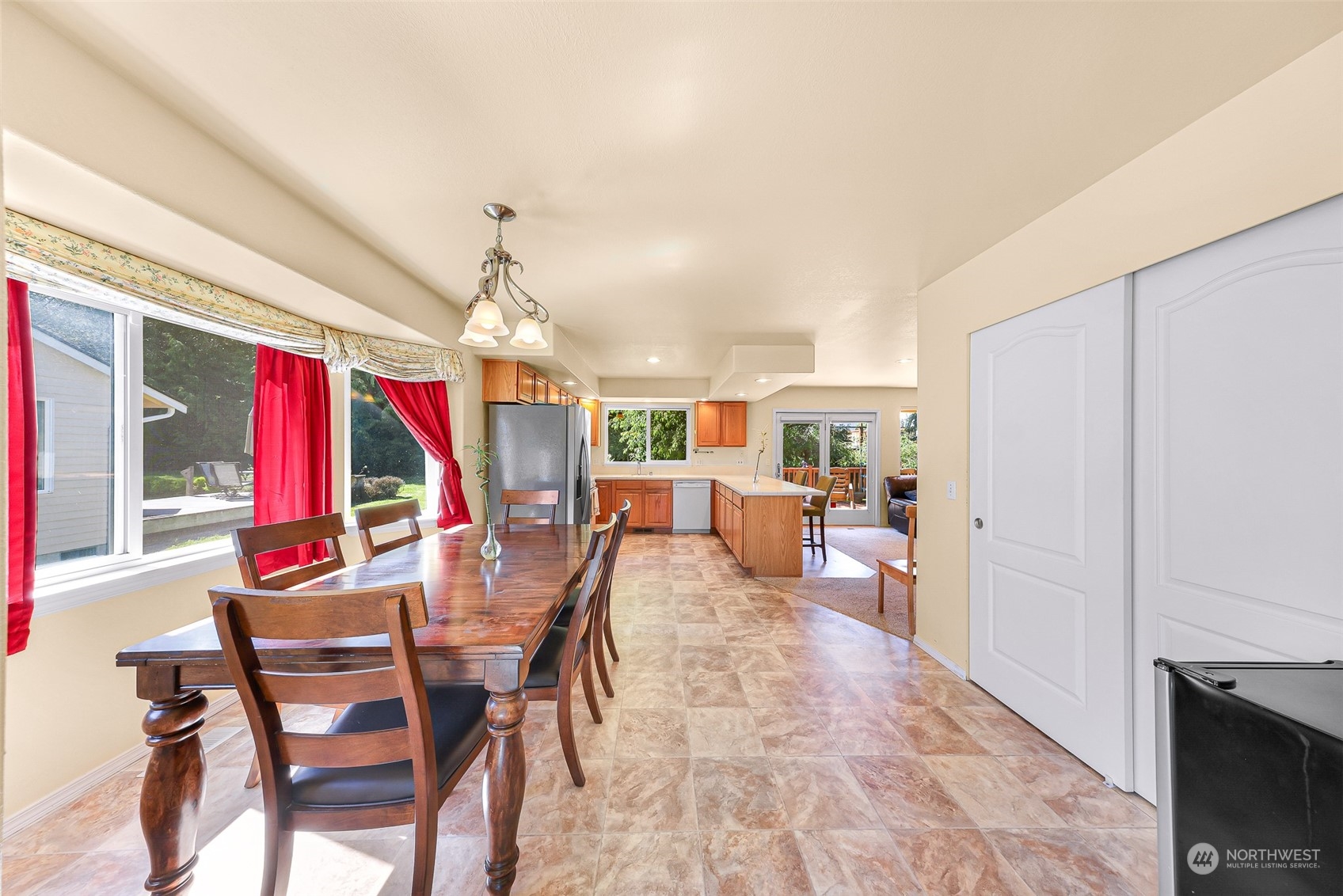 3827 Copper Pond Anacortes, WA 98221 - Photo 5 of 26 a view of a dining room with furniture window and outside view