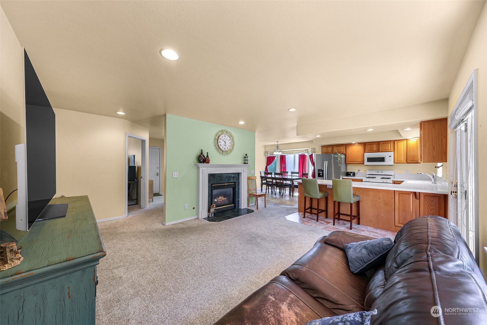 3827 Copper Pond Anacortes, WA 98221 - Photo 9 of 26 a living room with furniture and a fireplace