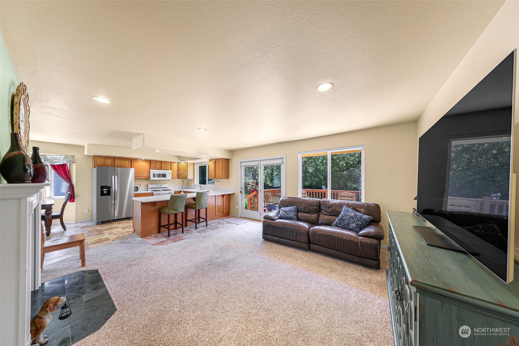 3827 Copper Pond Anacortes, WA 98221 - Photo 10 of 26 a living room with furniture and a flat screen tv