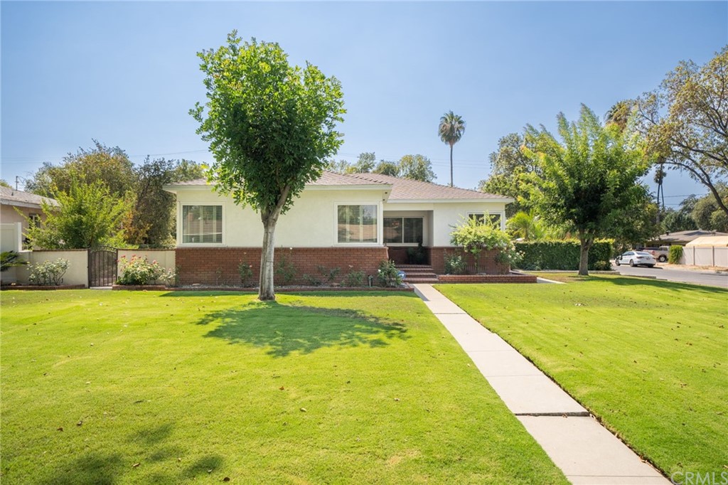 4690 Cover Street Riverside, CA 92506 - Photo 1 of 1 a house with swimming pool in front of it