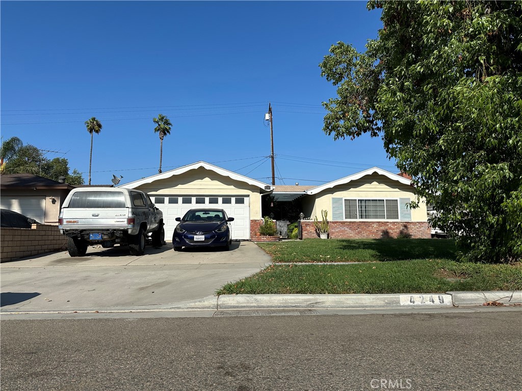 4249 Wheeler Street Riverside, CA 92503 - Photo 1 of 1 a view of a house with a large space and a car parked in front of it