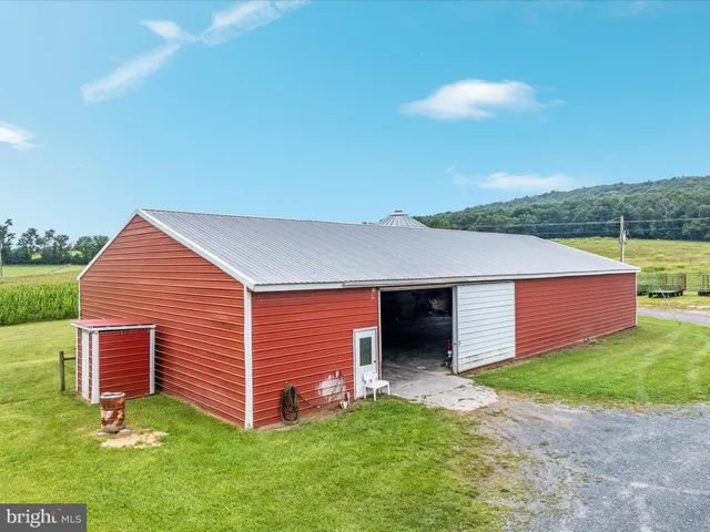 a view of a house with a yard porch and sitting area
