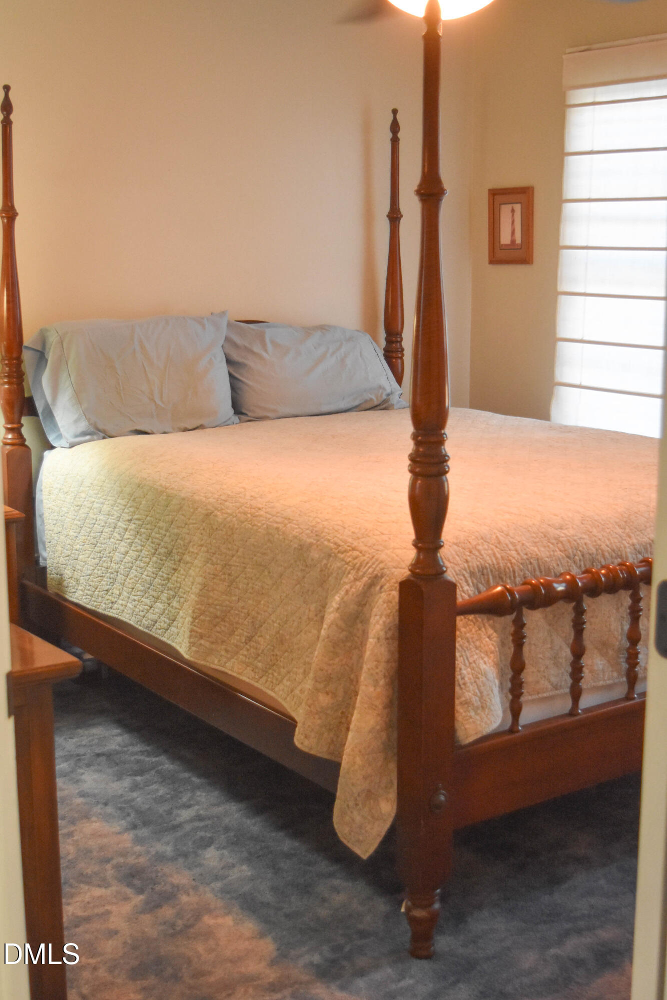 5908 Deep Spring Circle Wake Forest, NC 27587 - Photo 34 of 51 a bed sitting in a bedroom next to a window