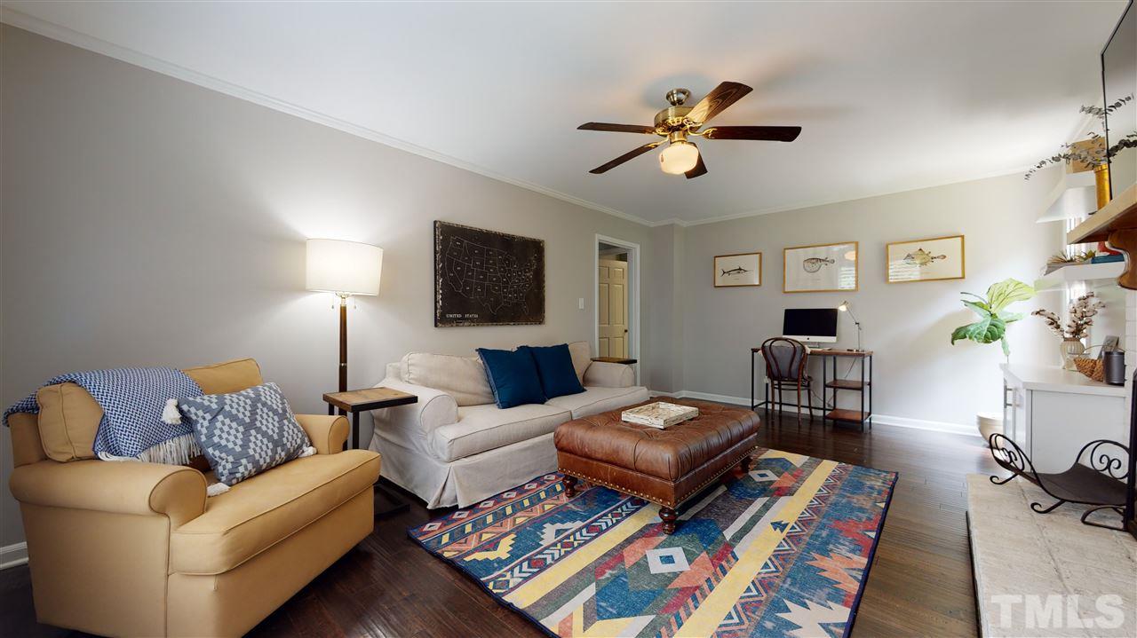2104 Chrisdale Court Raleigh, NC 27607 - Photo 14 of 29 a living room with furniture and a flat screen tv