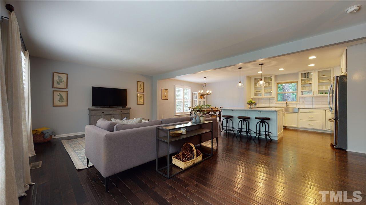 2104 Chrisdale Court Raleigh, NC 27607 - Photo 3 of 29 a living room with furniture and a flat screen tv